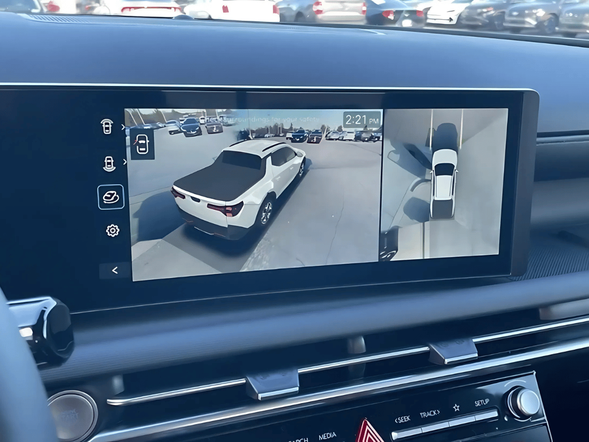 360-degree camera view displayed on the touchscreen of a 2025 Hyundai Santa Cruz, highlighting parking assistance features.