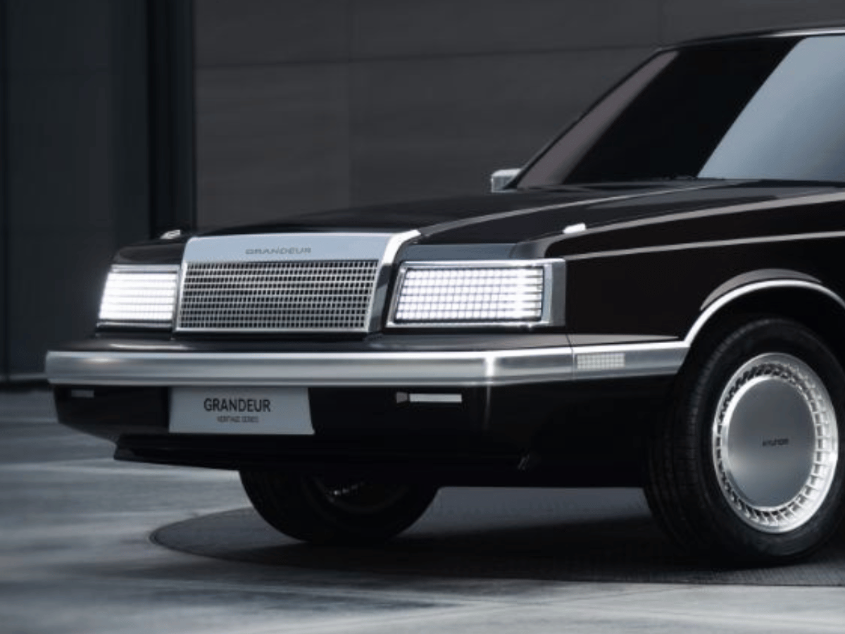 Front view of the Hyundai Grandeur Heritage Series concept, showcasing retro-inspired LED headlights and a modernized grille design.